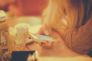 Woman viewing a website on her mobile device.